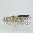 Pulsera Negra Herraje Triple Corona 5.3gr / 6mm Bolas Lisas 12und Circones Blancos Dos Oros Amarillo Blanco 18K