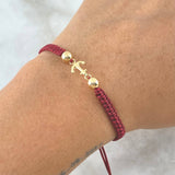 Pulsera Vinotinto Herraje de Ancla 0.55gr / 5mm Bolas Lisas Oro Amarillo 18K