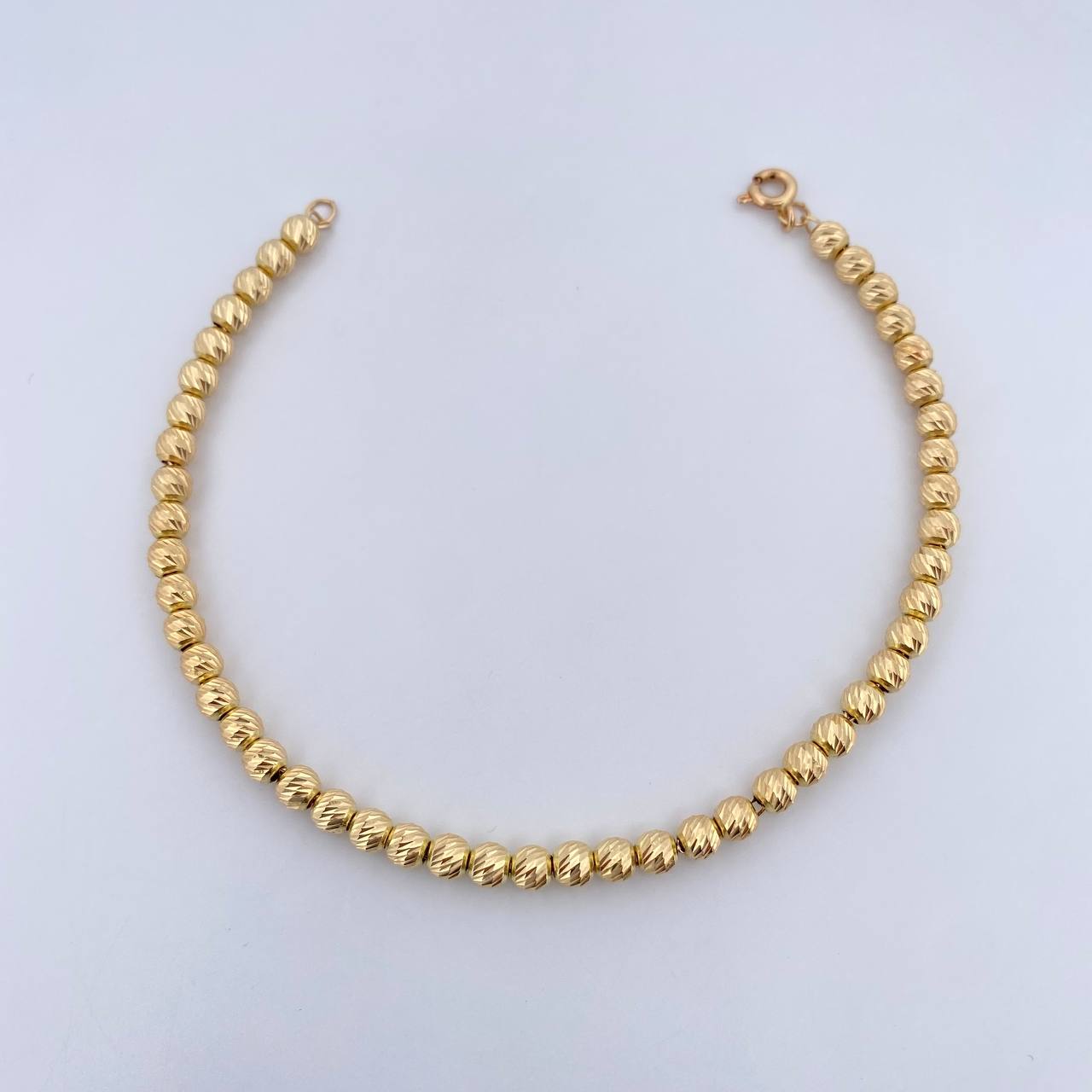 Pulso Tipo Militar 4.55gr / 19.1cm / 4mm Bolas Diamanatadas Oro Amarillo 18K $