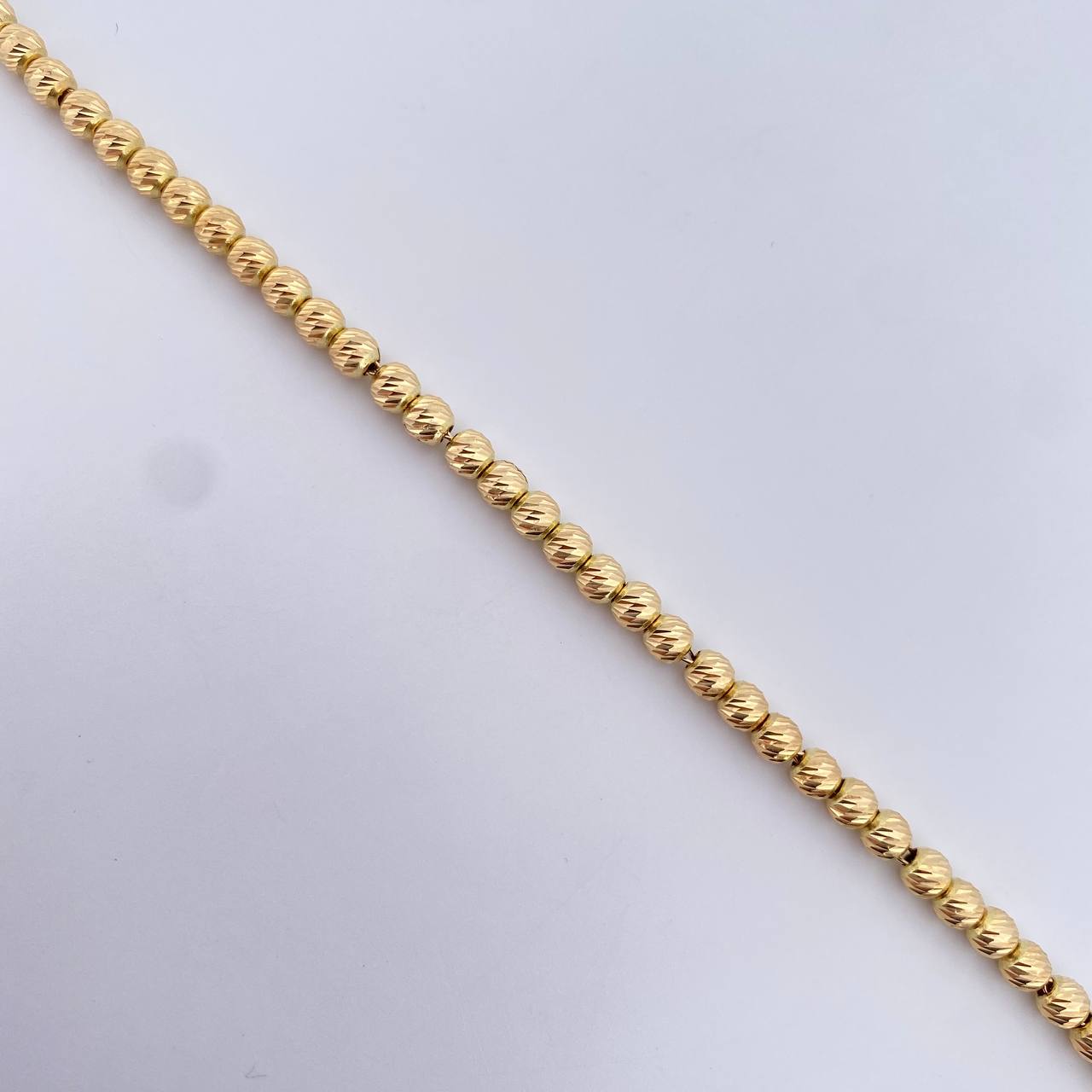 Pulso Tipo Militar 4.55gr / 19.1cm / 4mm Bolas Diamanatadas Oro Amarillo 18K $