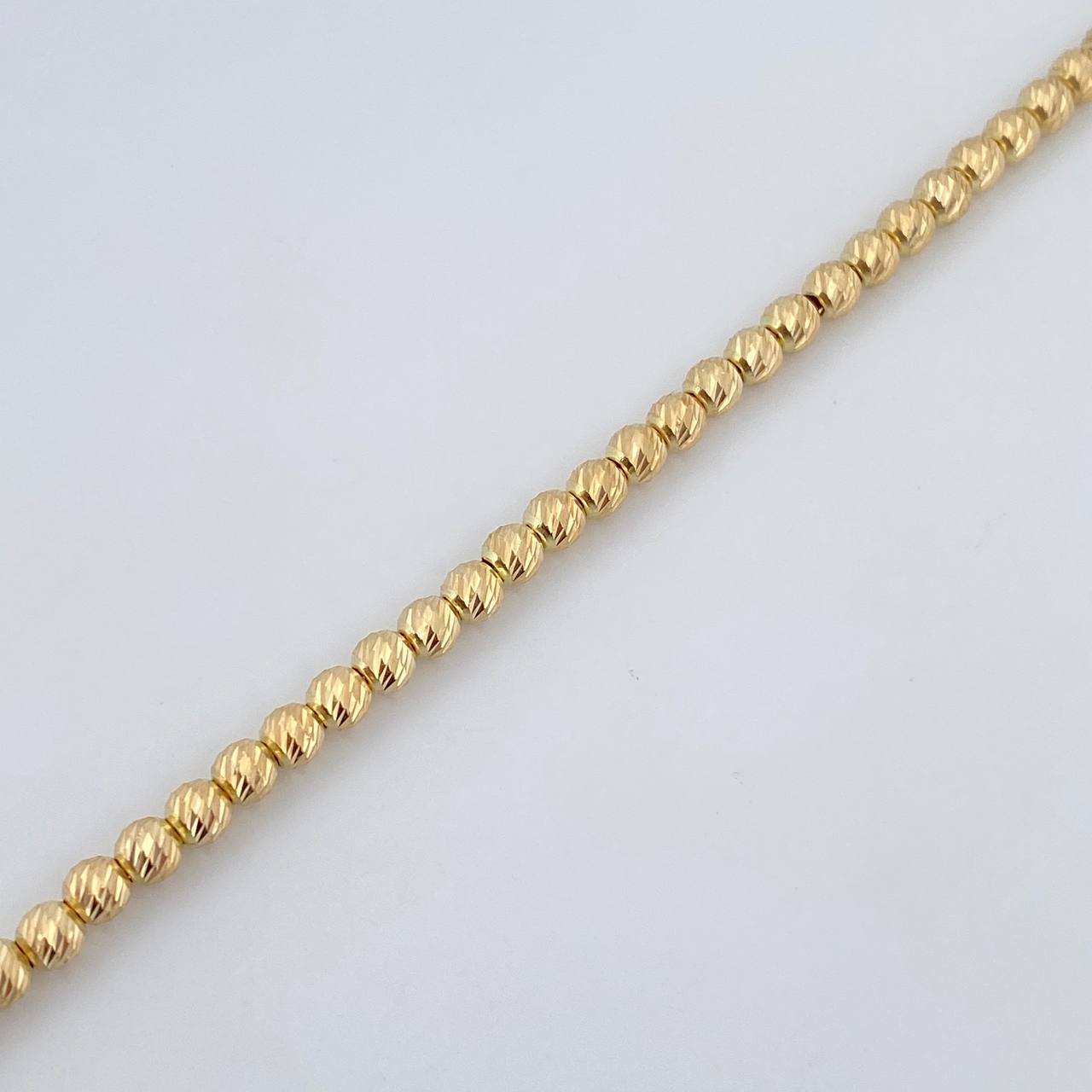 Pulso Tipo Militar 4.6gr / 19.4cm / 4mm Bolas Diamantadas Oro Amarillo 18K $