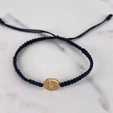 Pulsera Herraje Negra San benito 0.75gr / Troquelada Oro Amarillo 18K &