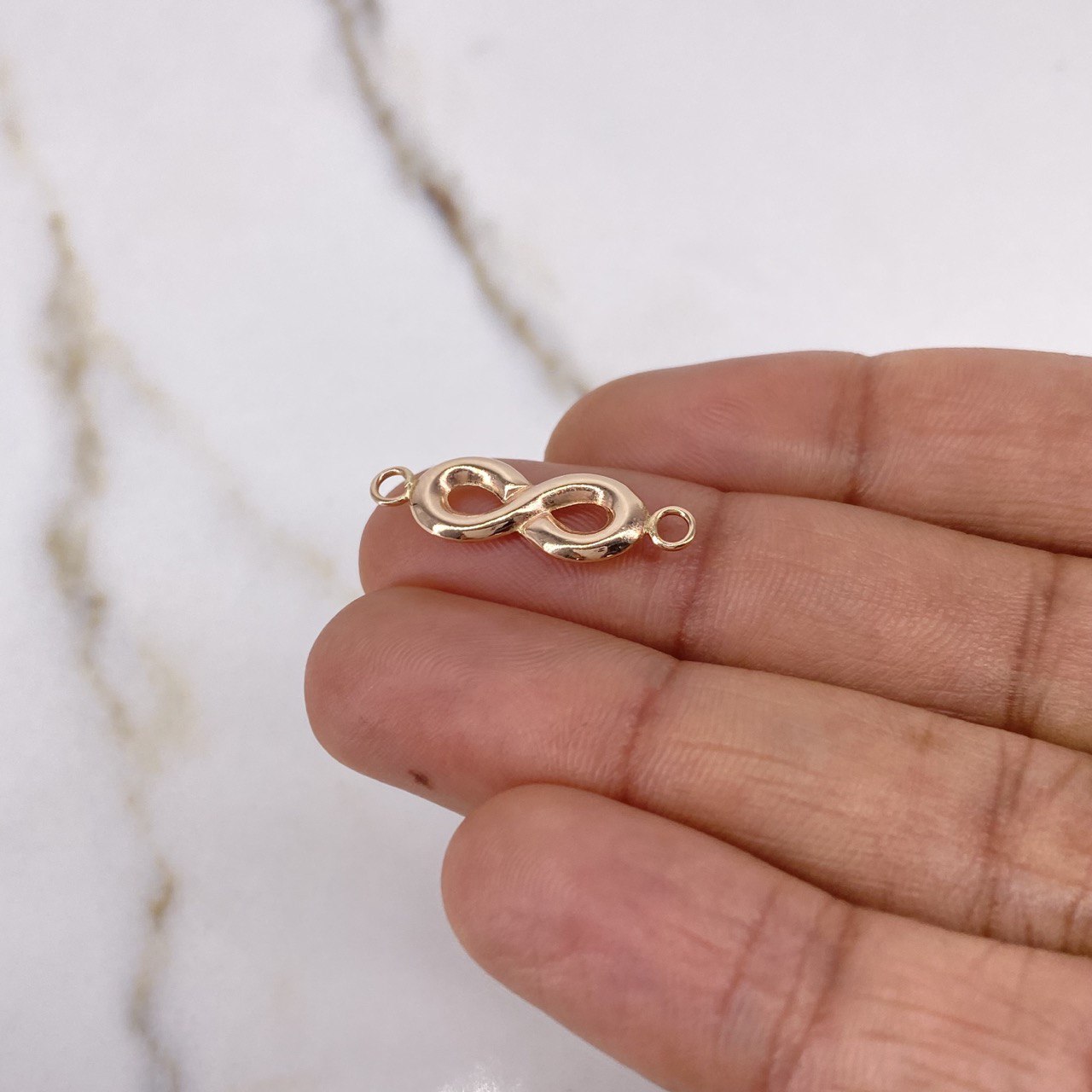 Herraje Infinito 0.65gr / 2.5cm / Oro Rosa $