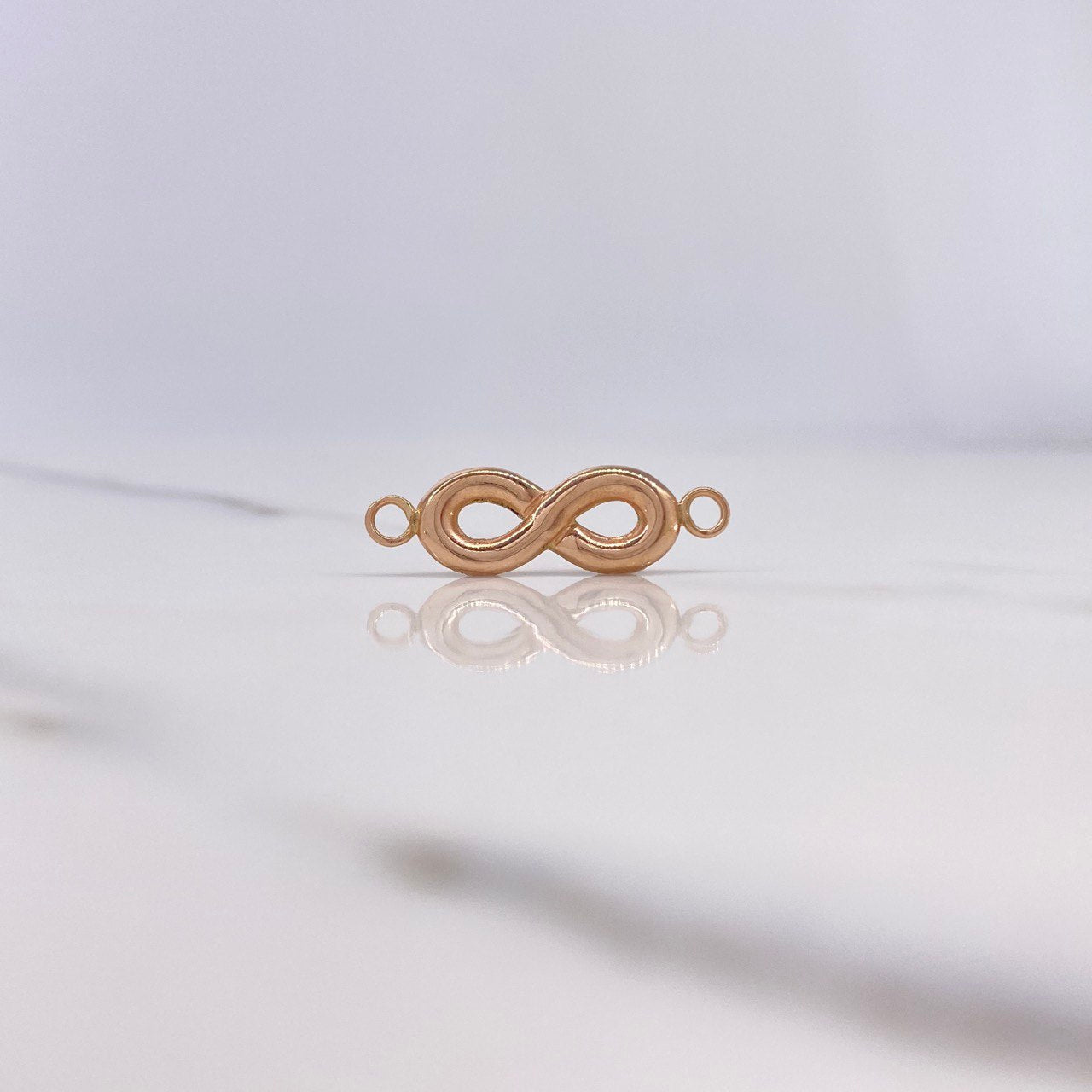 Herraje Infinito 0.65gr / 2.5cm / Oro Rosa $