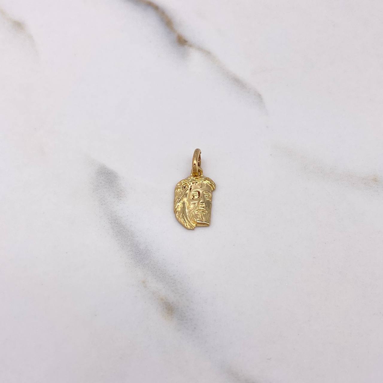 Dije Rostro Cristo 0.65gr / 1.9cm / Oro Amarillo $