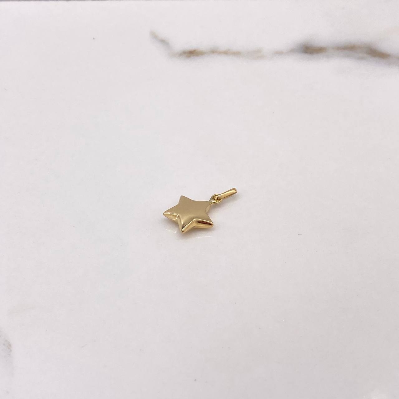 Dije Estrella 0.45gr / 1.9cm / Liso Oro Amarillo $