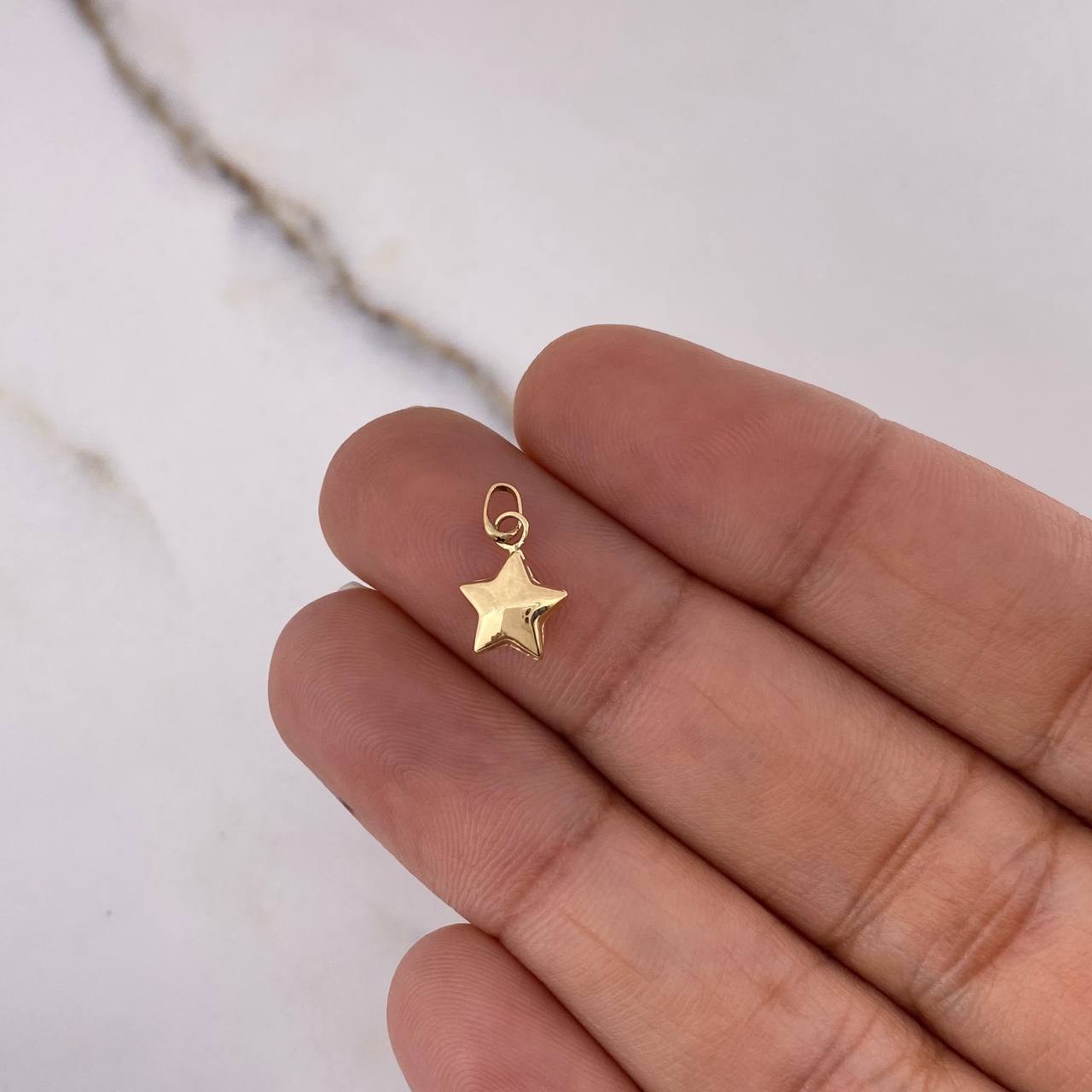 Dije Estrella  0.2gr / 1cm / Liso  Oro Amarillo $