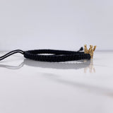 Pulsera Negra Corona 1.75gr / 1cm / Circones Blancos Oro Amarillo $