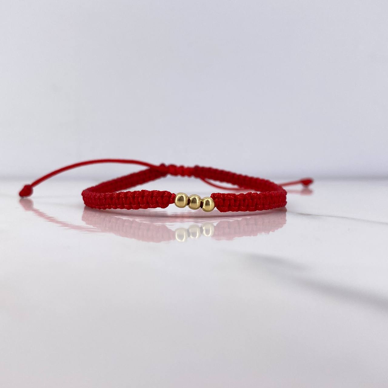 Pulsera Roja Bolas 0.15gr / 3mm Oro Amarillo $