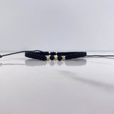 Pulsera Negra Bolas Diamantadas 0.25gr / 3mm Neoprenos Negros Oro Amarillo $