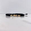 Pulsera Negra Herraje Infinito 0.95gr / 3mm-4mm Bolas Diamantadas Oro Amarillo $