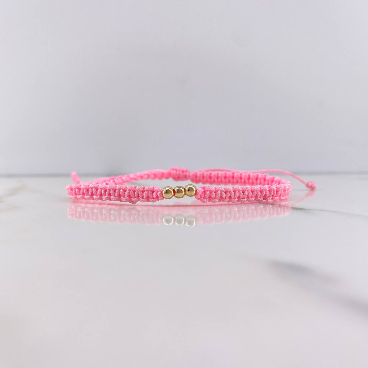 Pulsera Rosado Bolas Lisas 0.15gr / 3mm Oro Amarillo $