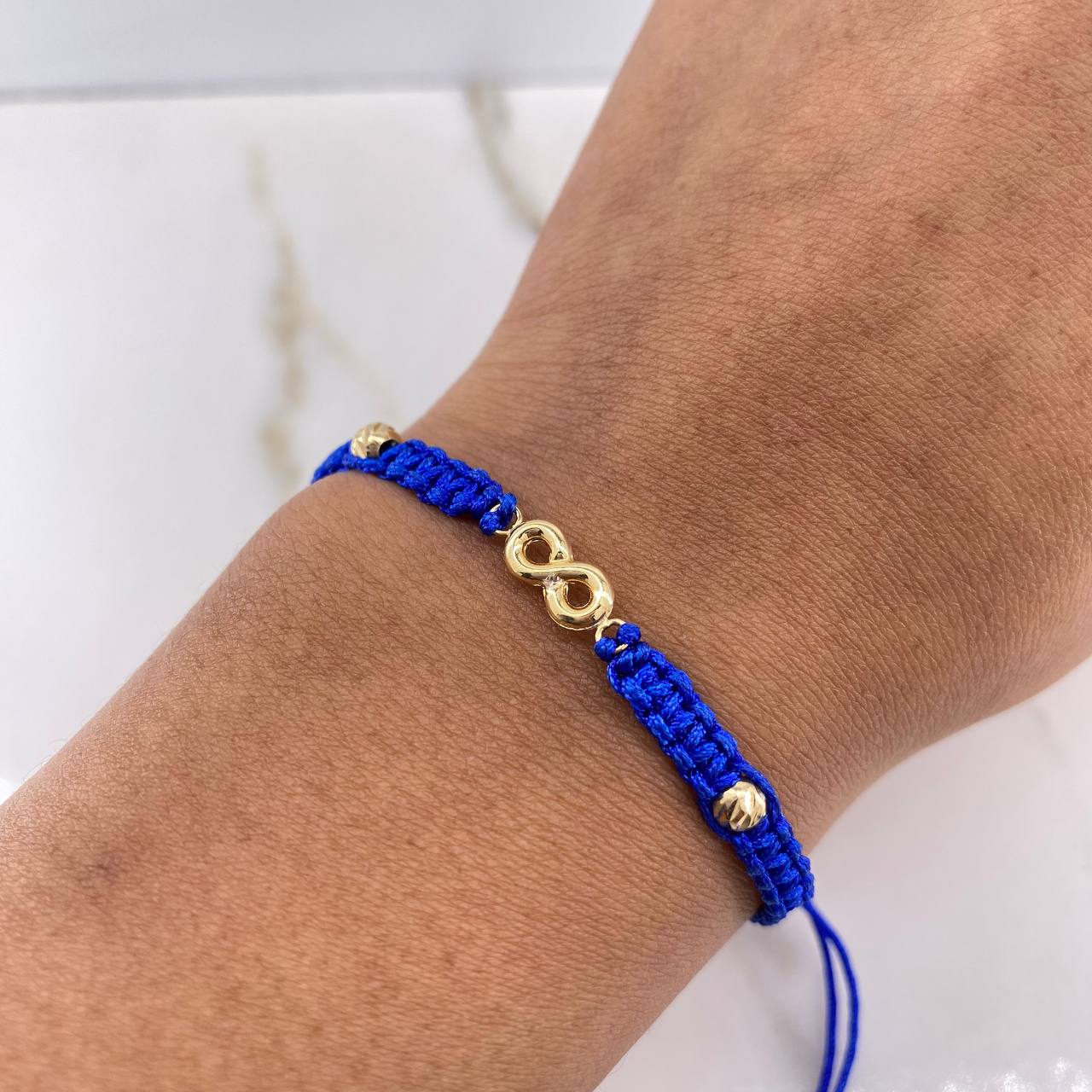 Pulsera Azul Herraje Infinito 0.7gr / 3mm-4mm Bolas Diamantadas Oro Amarillo $