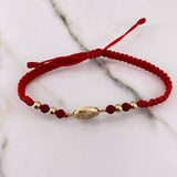 Pulsera Roja Herraje San Benito 1.1gr / 4mm Troquelado Bolas Lisas Oro Amarillo $