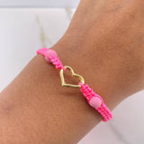 Pulsera Rosada Silueta Corazon 0.5gr / Bolas Neoprenos Rosadas Oro Amarillo $