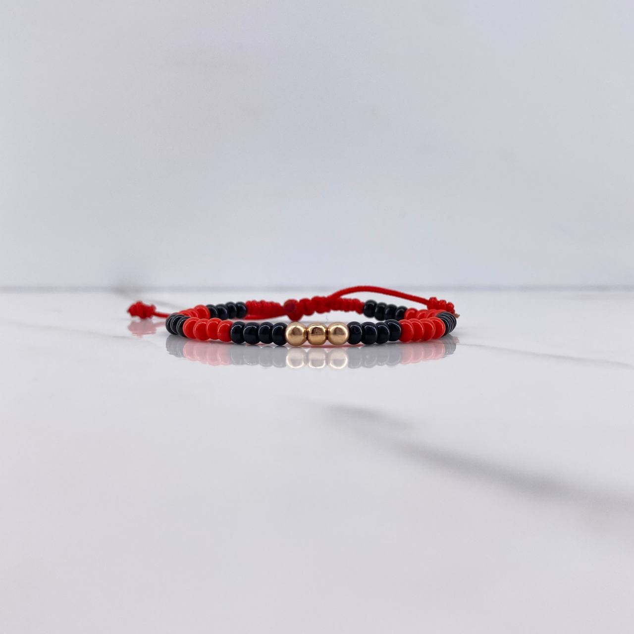 Pulsera Roja Negra Mostazilla 0.15gr / 3mm Bolas Lisas Oro Rosa $