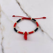 Pulsera Roja Negra Mostazilla 0.55gr / 3mm Pie Bolas Diamantadas Oro Amarillo $