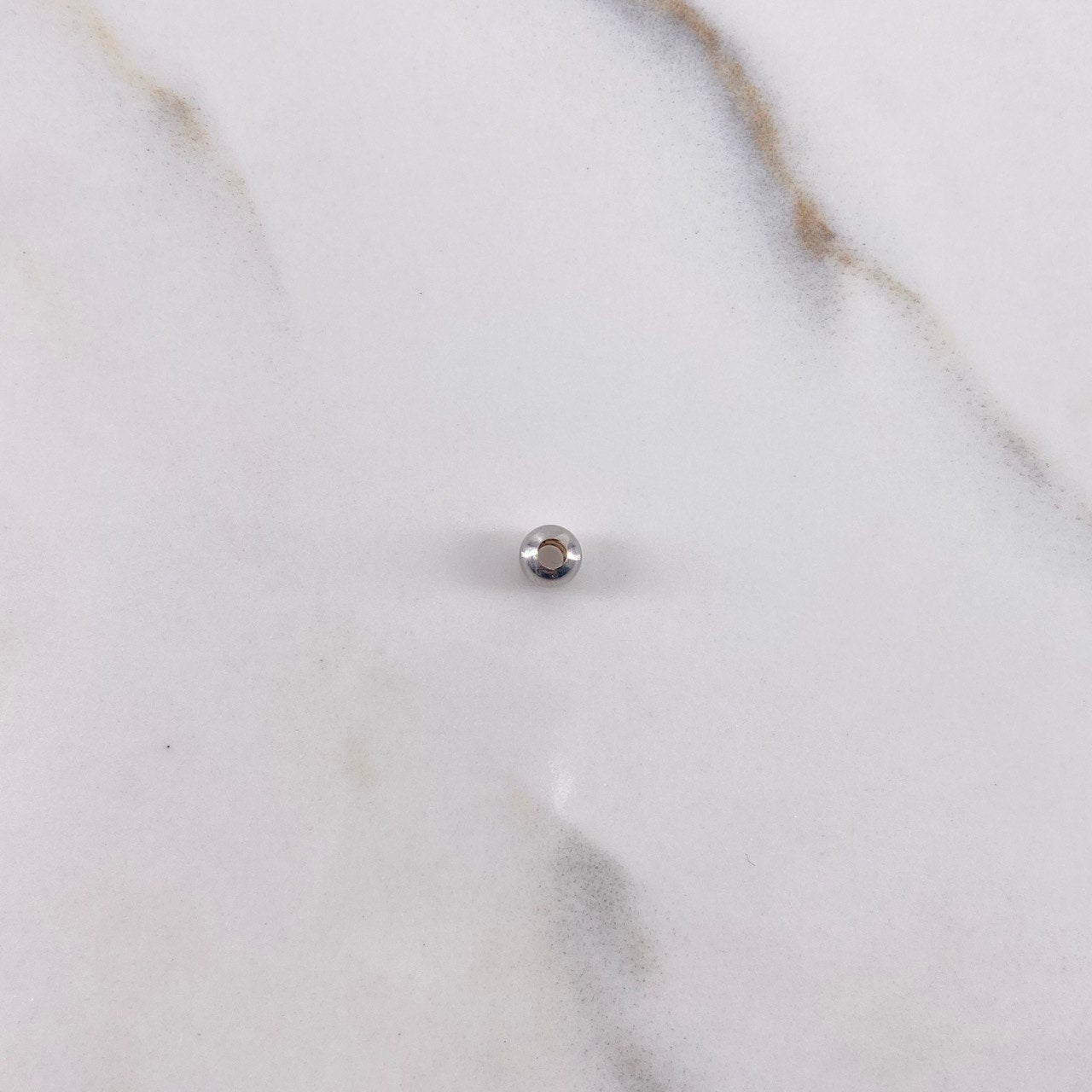 Bola Lisa 0.08gr / 4mm Oro Blanco $