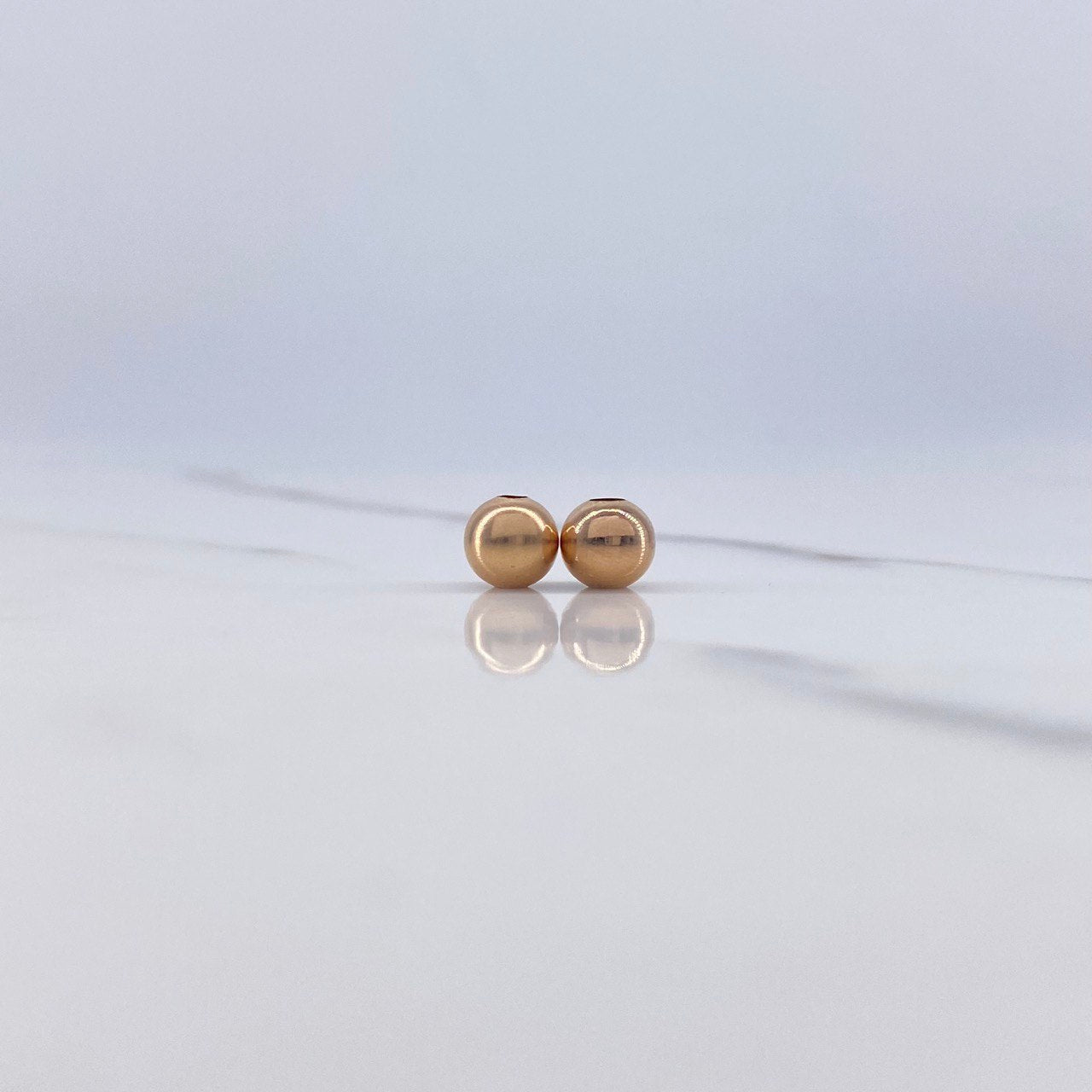 Bola Lisa 0.2gr / 6mm Oro Rosa $