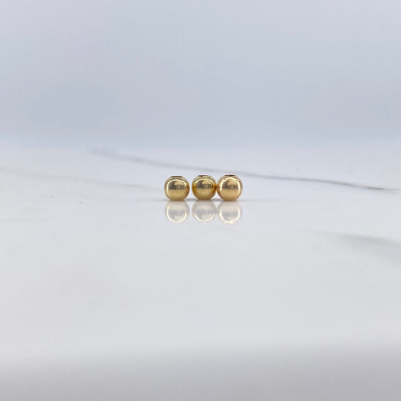 Bola Lisa 0.07gr / 4mm Oro Amarillo $