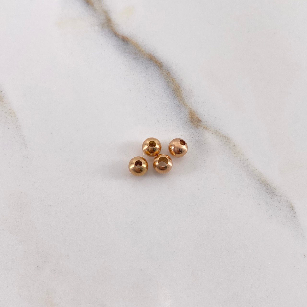 Bola Lisa 0.08gr / 4mm Oro Rosa $