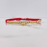 Pulsera Roja Virgen Milagrosa 1.3gr / 3mm Bolas Lisas Oro Amarillo $