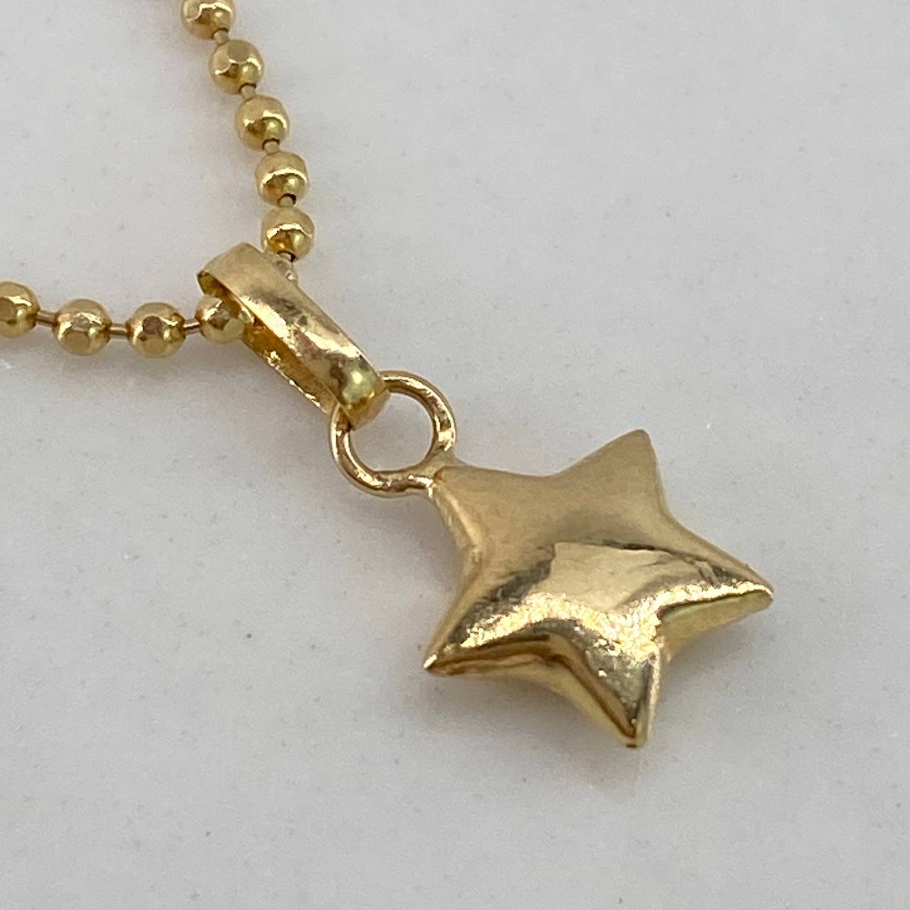 Dije Estrella 0,25gr / 1cm / Liso Oro Amarillo$