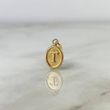 Dije Letra T Ovalada 0.4gr / 1.8cm / Troquelada Oro Amarillo