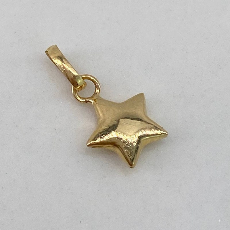 Dije Estrella  0.25gr / 1cm / Liso  Oro Amarillo $