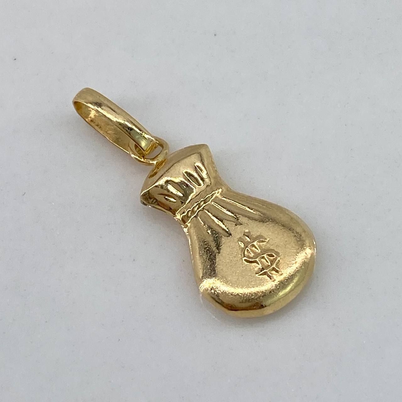 Dije Bolsa de Dinero  0.6gr / 2cm / Liso  Oro Amarillo $