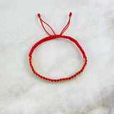 Pulsera Roja Cilindrica 2.5gr / 2mm Diamantada 30 und Oro Amarillo