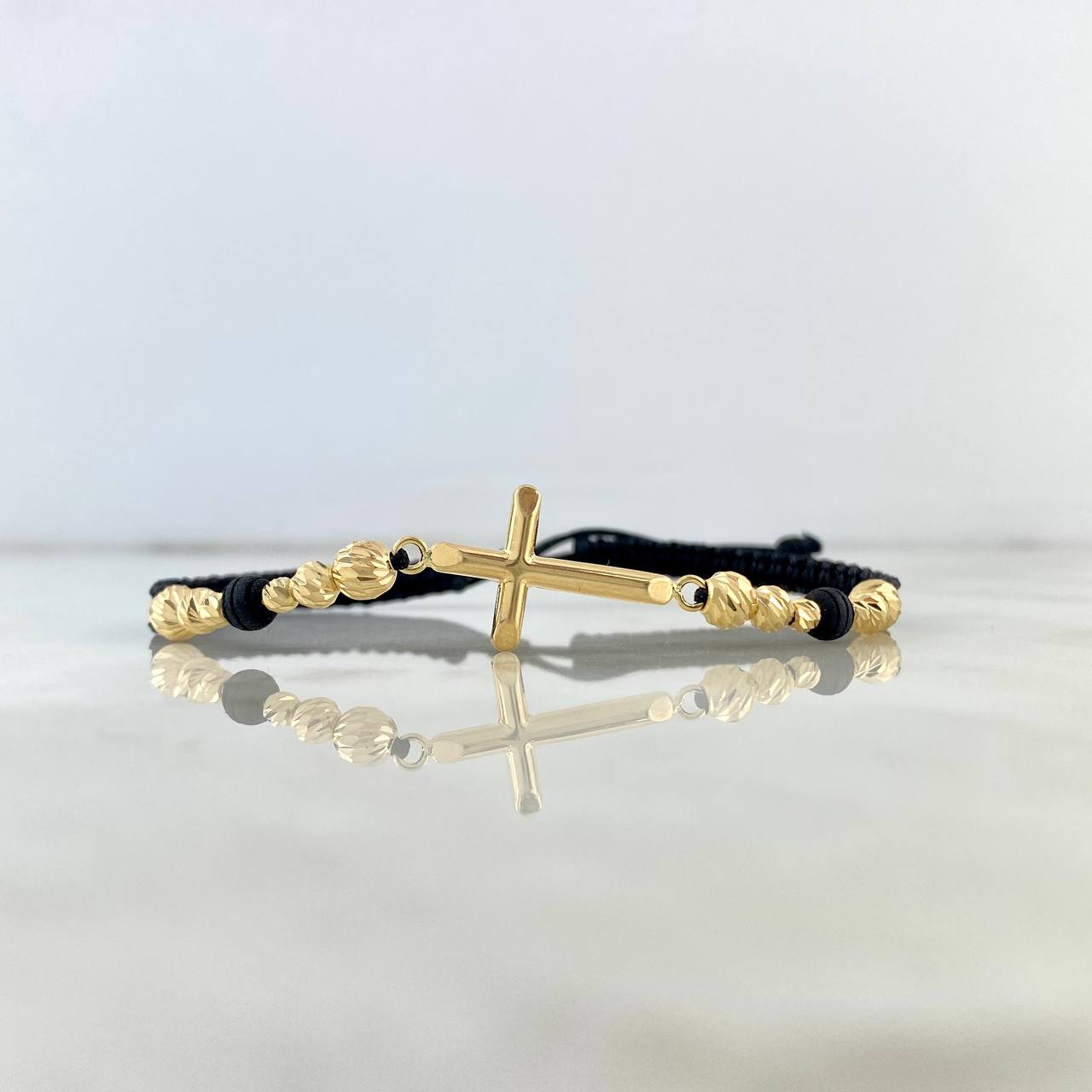 Pulsera Negra Cruz Troquelada Gradual 1.9gr / 5mm-4mm-3mm Bolas Diamantadas 12 und Oro Amarillo *