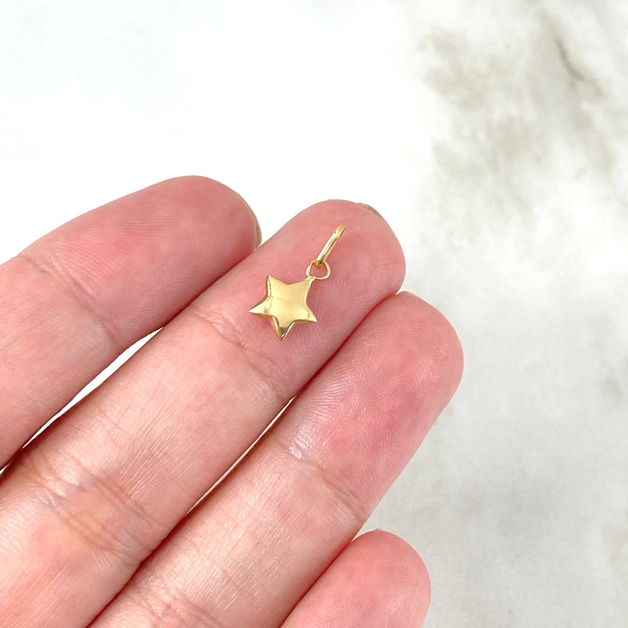 Dije Estrella 0.25gr / 1.2cm / Oro Amarillo