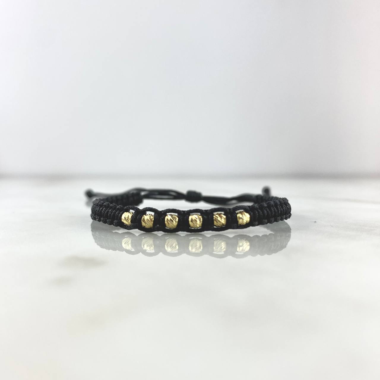 Pulsera Negra Lineal 0.5gr / 3mm Bolas Diamantadas 6 Und Oro Amarillo ©