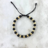 Pulsera Negra Intercalada 3.25gr / 6mm Bolas Satinadas 15 Und Neoprenos Rayados Oro Amarillo *