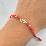 Pulsera Roja Infinito 0.45gr / 4mm Bolas Lisas 2 Und Oro Amarillo