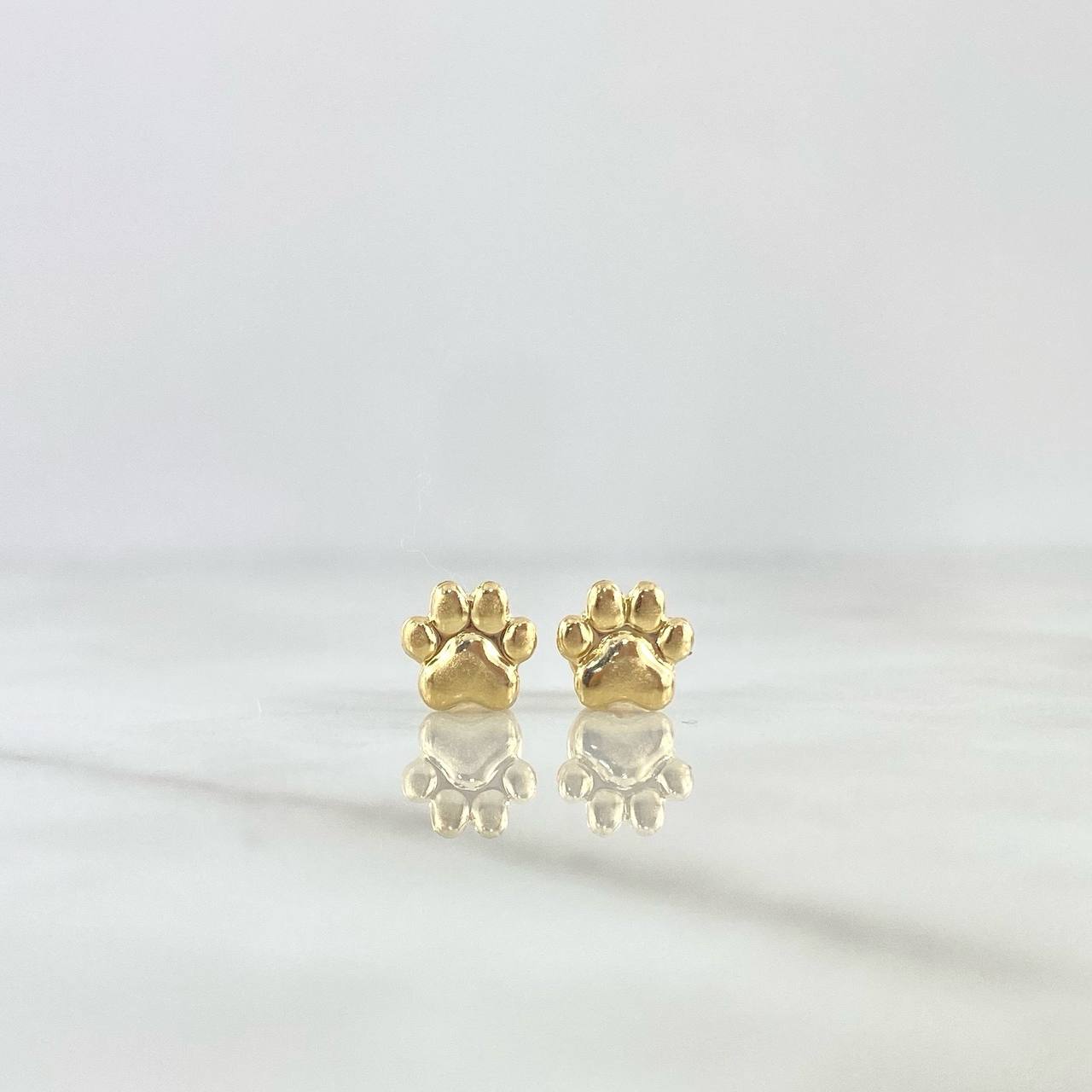 Topos Huella 0.6gr / 7mm Oro Amarillo ©