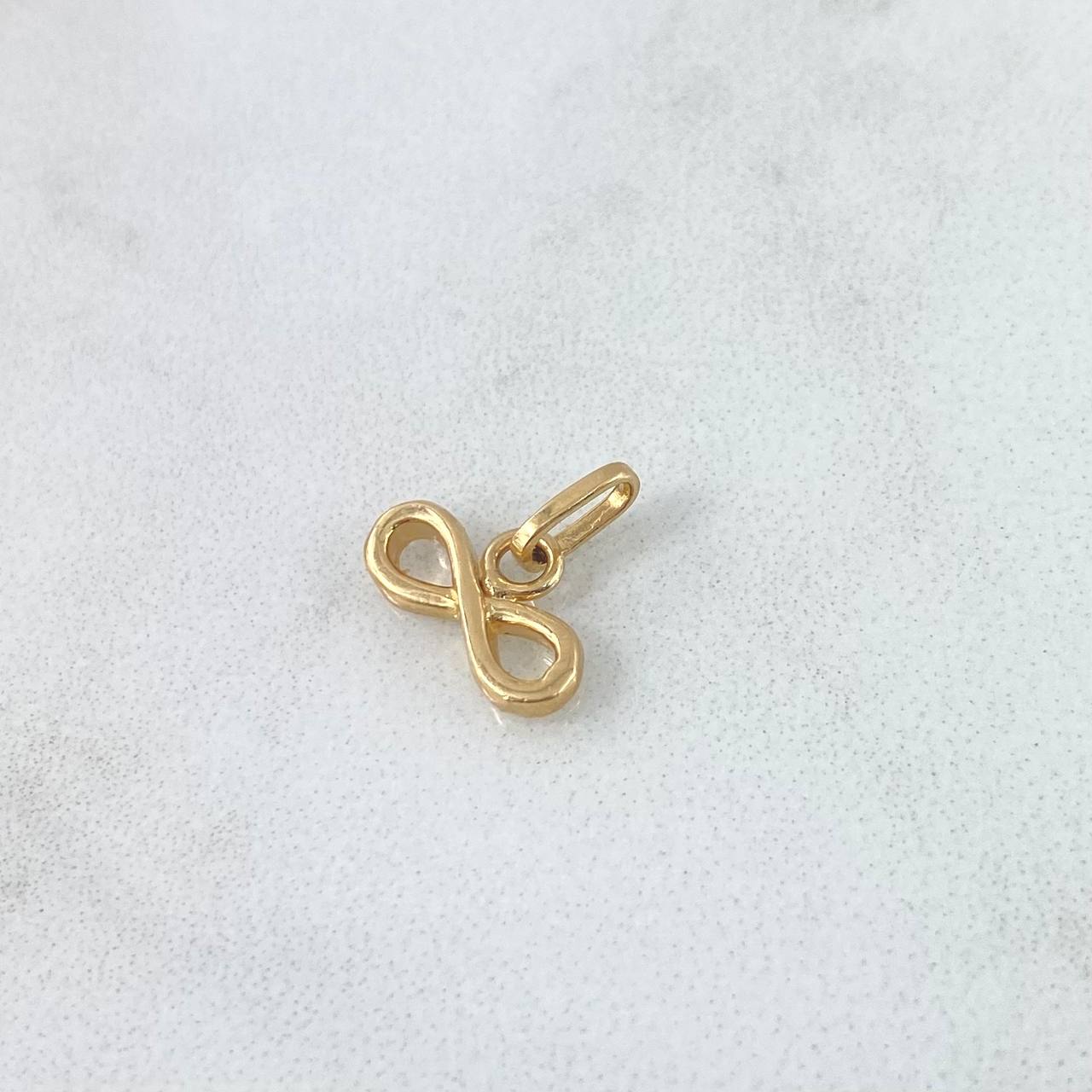 Dije Infinito 0.6gr / 1cm / Silueta Lisa Oro Amarillo