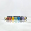 Pulsera Negra Siete Chakras 0.4gr / 6mm Bolas Lisas 2 und Piedras Volcanicas Oro Amarillo 18K ©