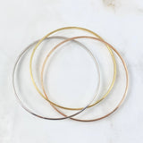 Pulso Tres Aros Circulares 9.75gr / 22cm / 3mm Tres Oros +4 18K ©