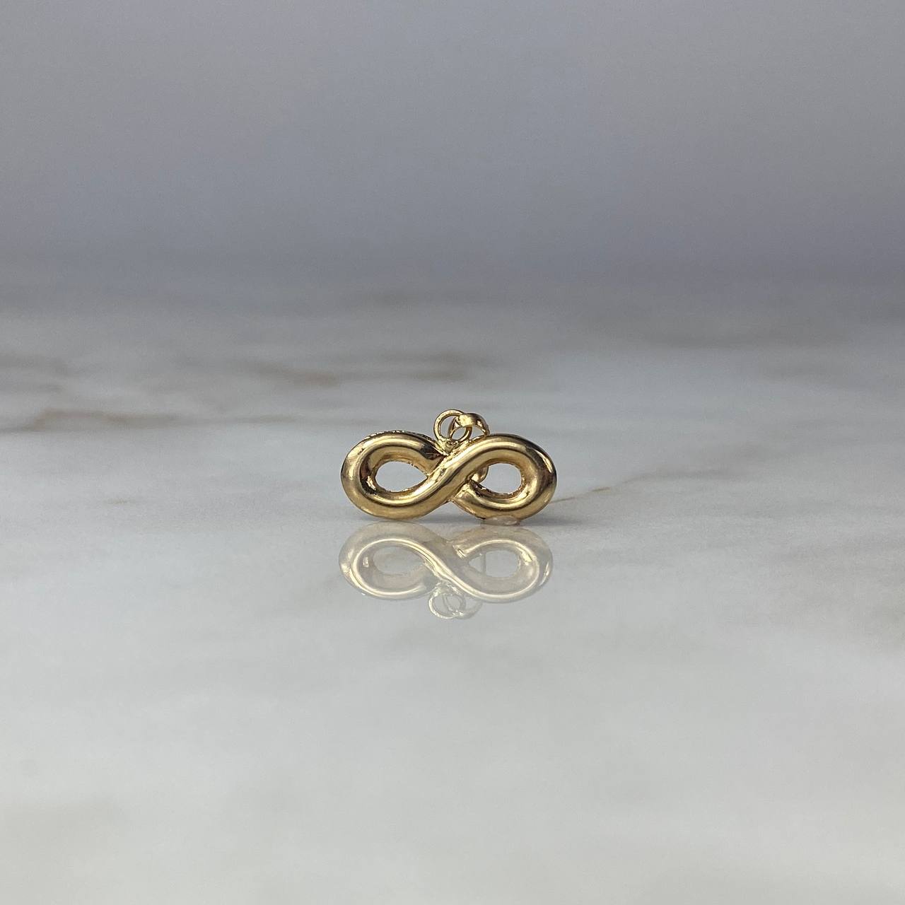 Dije Infinito  0.8gr / 1.5cm Troquelado Oro Amarillo