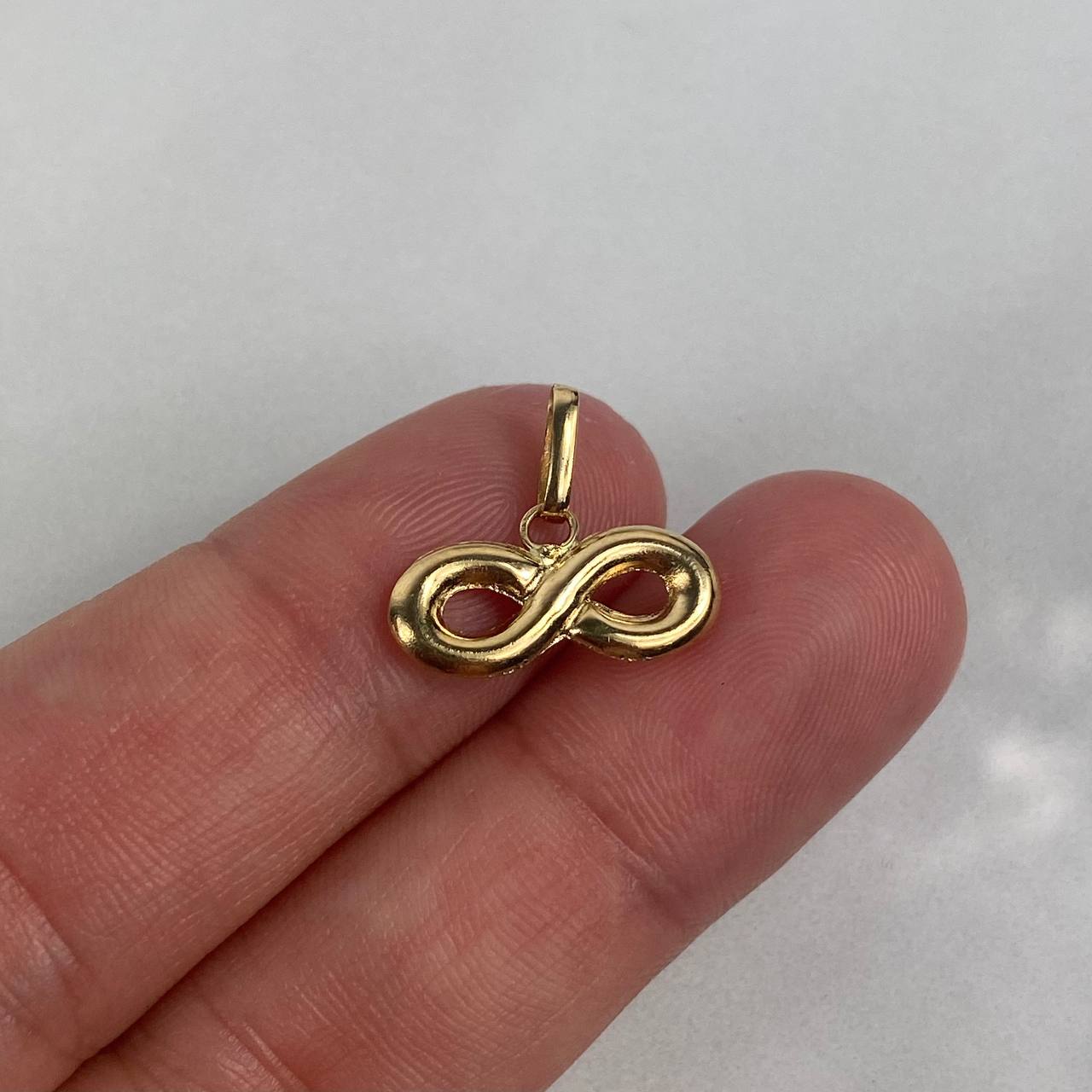 Dije Infinito  0.85gr / 1.5cm Troquelado Oro Amarillo