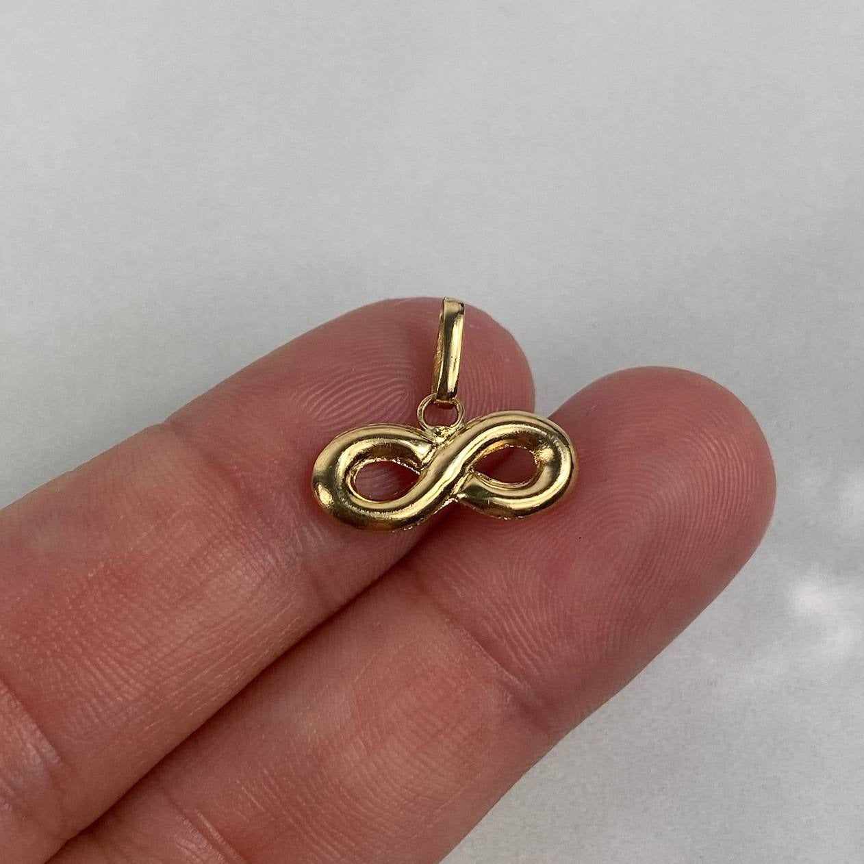 Dije Infinito 0.75gr / 1.7cm / Troquelado Oro Amarillo $