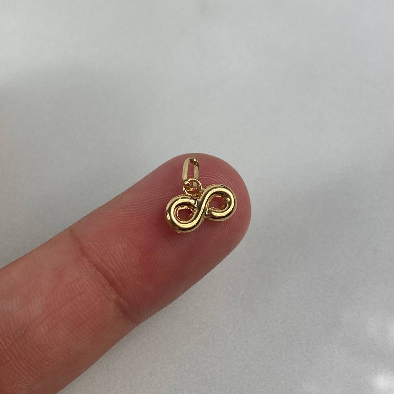 Dije Infinito  0.4gr / 1.1cm Troquelado Oro Amarillo