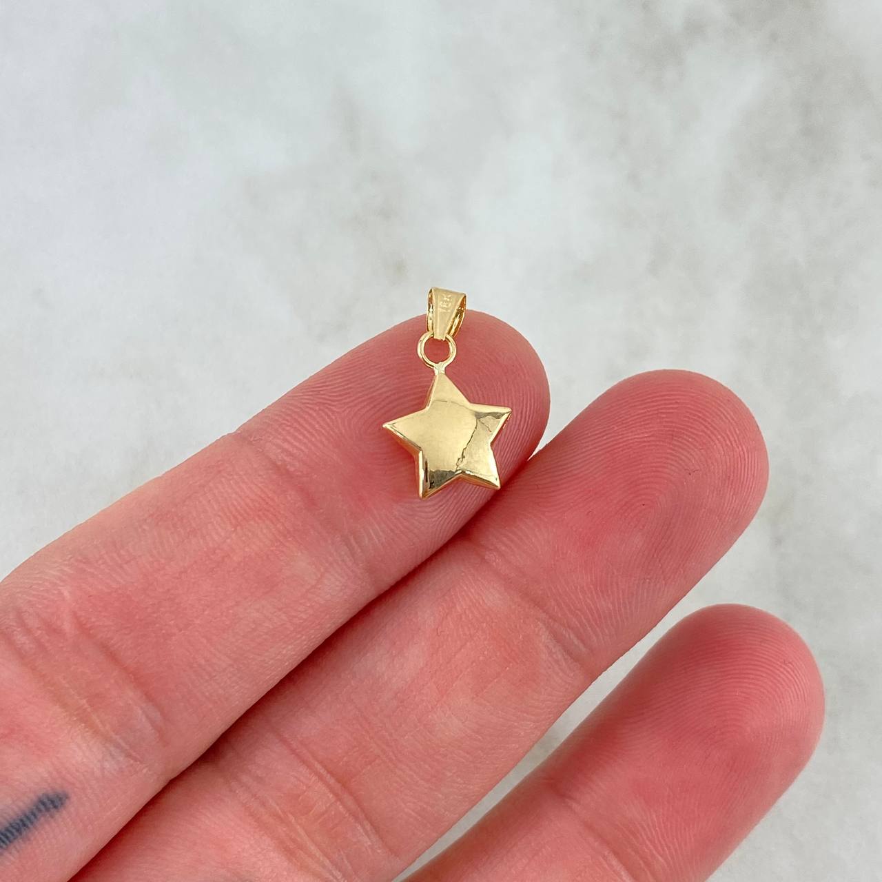 Dije Estrella 0.45gr / 1.7cm / Oro Amarillo