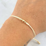 Pulsera Beige Trio Disimil 0.25gr / 4mm-3mm Bolas Lisas 3 und Oro Amarillo ©