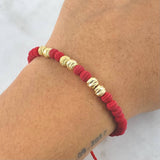 Pulsera Roja Neo Rayada 1.5gr / 5mm Bolas Satinadas 6 und Oro Amarillo *