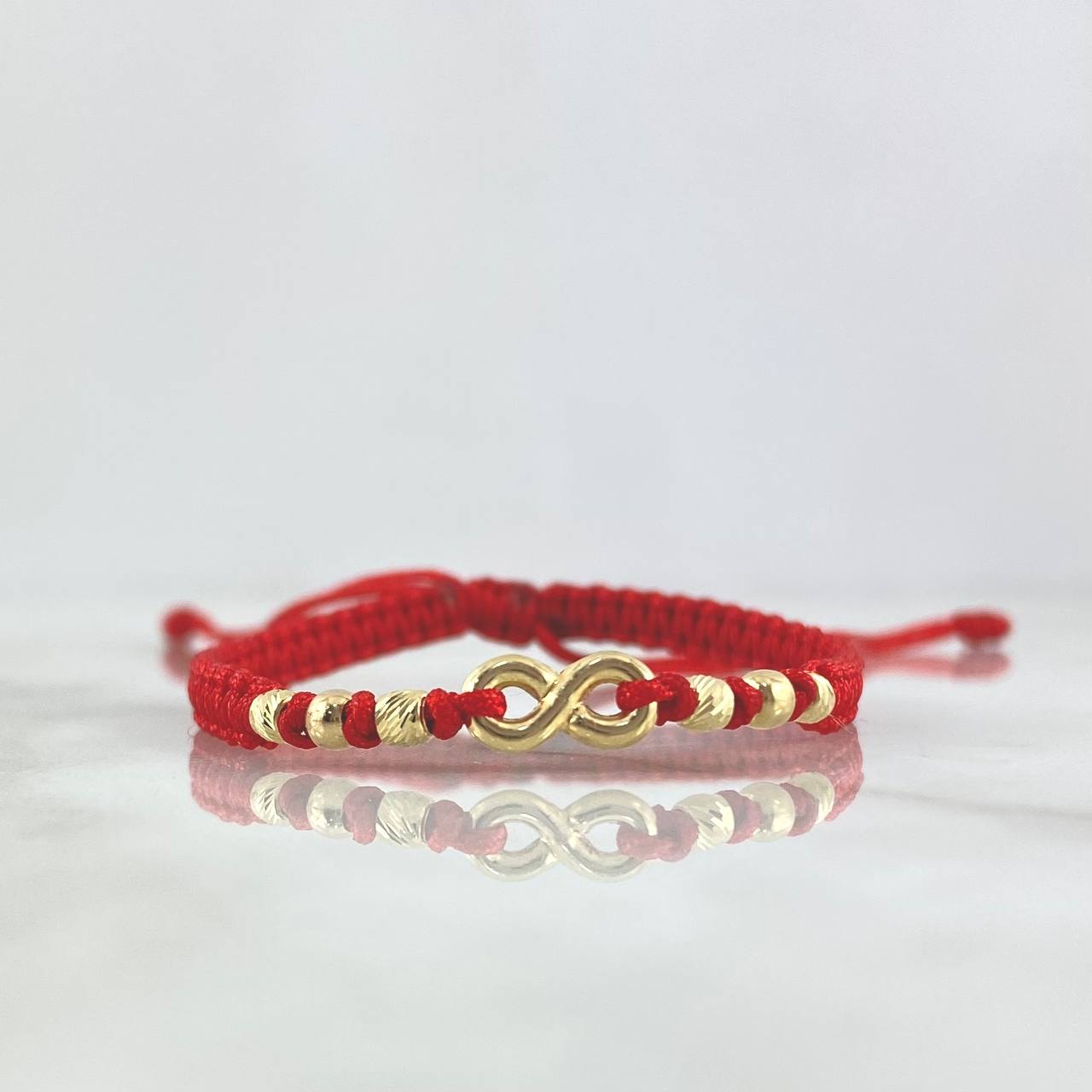 Pulsera Roja Infinito 0.8gr / 3mm Bolas Lisas Diamantadas 6 und Oro Amarillo ©