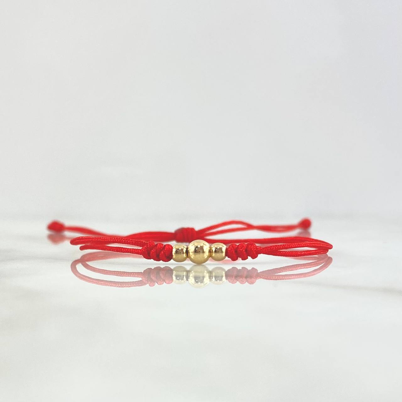 Pulsera Roja Trio Disimil 0.25gr / 4mm-3mm Bolas Lisas 3 und Oro Amarillo ©