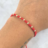 Pulsera Roja Anudada Serpiente 0.45gr / 3mm Bolas Lisas Diamantadas 7 und Oro Amarillo *